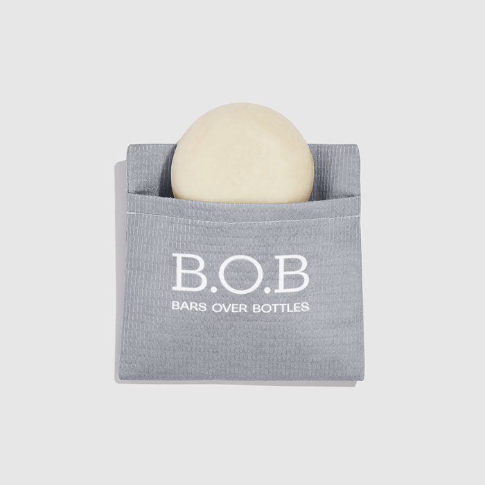 bolsinha para transporte de shampoo em barra cinza